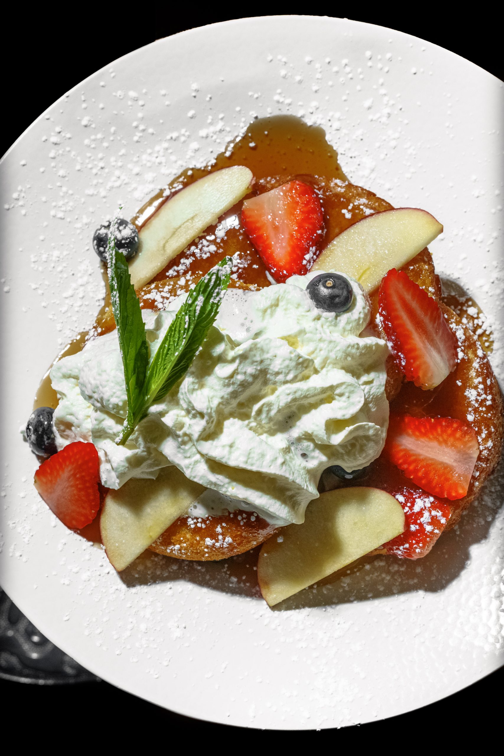 Pancake with fresh fruits and whipped cream